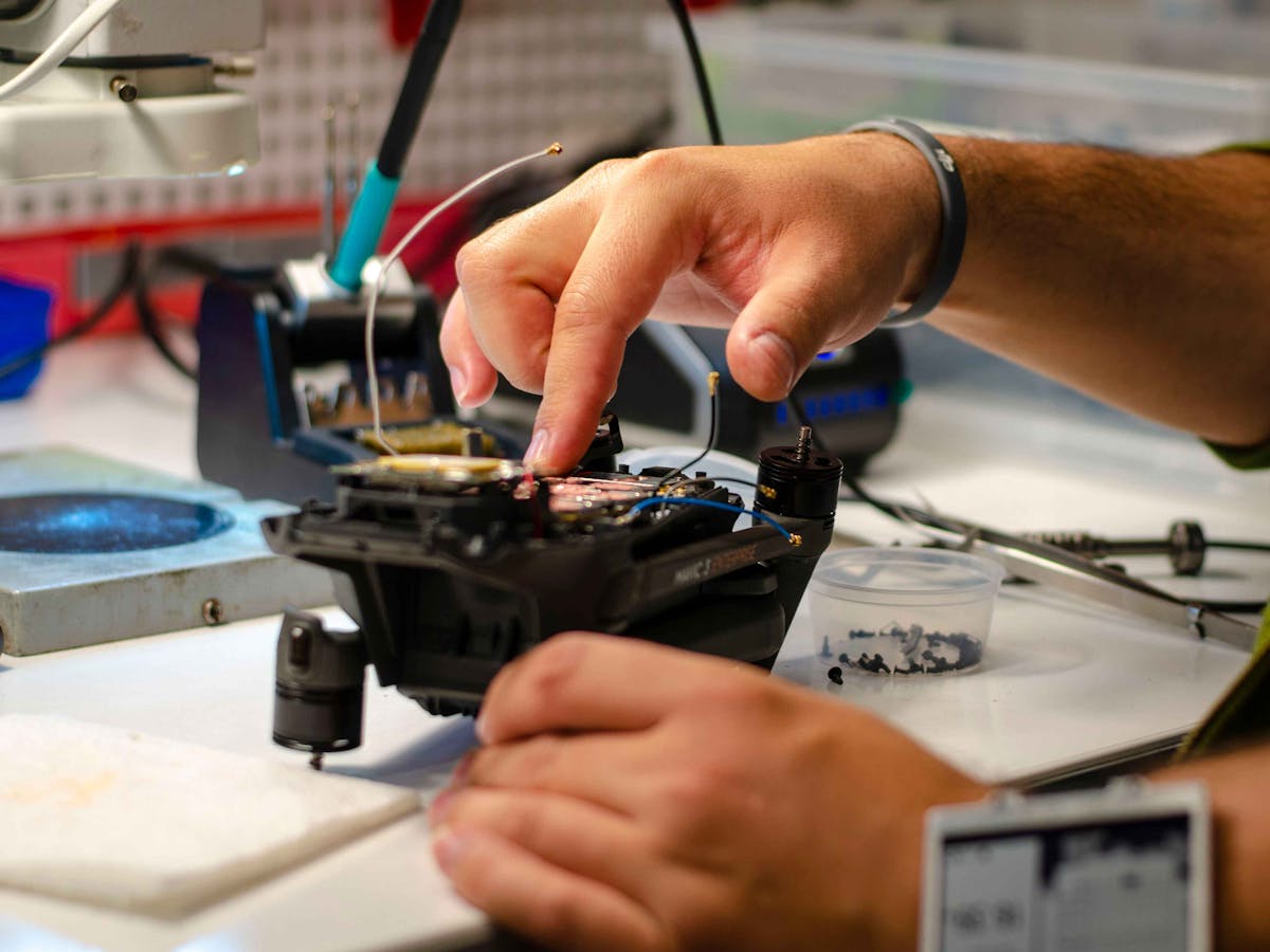 Close-up of drone repair on a workbench